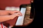 Girl Plays Piano Stock Photo