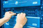 Man Fix Server Network In Data Center Room Stock Photo