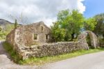 Old Historic House As Ruins Along Road Stock Photo