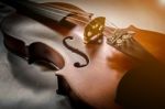 The Violin On The Table, Close Up Of Violin On The Wooden Floor Stock Photo