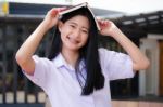 Asia Thai High School Student Uniform Beautiful Girl Read A Book Stock Photo