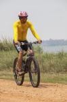 Young Man Wearing Rider Suit Riding Mountain Bike Mbt On Dusty R Stock Photo