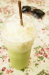 Glass Of Green Tea Latte Frappe Stock Photo