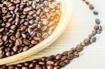 Coffee Beans On A Wood Plate Stock Photo