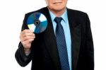 Cropped Image Of A Male Showing Compact Disk Stock Photo