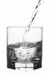 Water With Air Bubbles Pouring Into Glass, Closeup View, Isolate Stock Photo