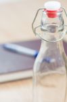 Vintage Water Bottle On Wooden Background Stock Photo