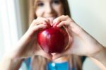 Beautiful Woman With Red Apple At Home Stock Photo