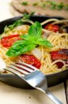 Spaghetti Pasta With Baked Cherry Tomatoes And Basil Stock Photo