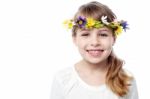 Smiling Kid Wearing Flower Wreath Stock Photo