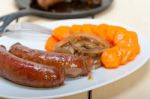 Beef Sausages Cooked On Iron Skillet Stock Photo