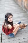 Portrait Of Young Girl Listening To Music Stock Photo