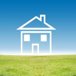 House Icon On Green Field Stock Photo