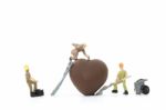 Miniature Worker Making Heart Shaped Chocolate On White Background , Stock Photo