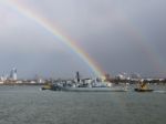 Hms Albion Being Towed Into Portsmouth Harbour Stock Photo