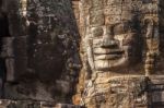 Ancient Stone Face Of Bayon Temple Stock Photo