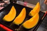 Cutting Japanese Melon Stock Photo