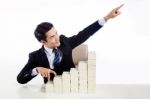 Young Man In Business Suit Show Finger Walking Up The Stair And Stock Photo