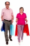 Couples Holding Shopping Bags Stock Photo