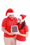 Couple Enjoying Their New Touchpad Stock Photo