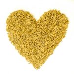 Pile Of Paddy Rice By Heart Shape On The White Background For Isolated Stock Photo