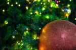 Close Up Big Red Glitter Ball Christmas On Tree With Wire White Light Background Stock Photo