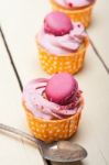 Pink Berry Cream Cupcake With Macaroon On Top Stock Photo