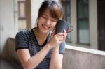 Portrait Of Thai Adult Beautiful Girl Drinking Coffee Stock Photo