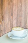 Hot Cup Of Coffee Latte On Wooden Background Stock Photo