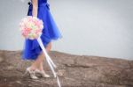 Beautiful Woman Wear Blue Evening Dress Hold A Bouquet Of Flower Stock Photo