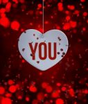 Abstract Heart Decorated On Red Blurred Lights Background Stock Photo