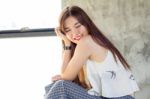 Portrait Of Thai Adult Beautiful Girl Relax And Smile Stock Photo