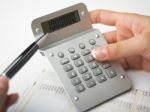 Bookkeeping With Calculator Stock Photo