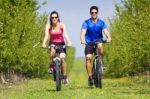 Happy Young  Couple On A Bike Ride In The Countryside Stock Photo