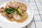 Rad Na, Famous Thai Chinese Style Wide Rice Noodle Dish With Tasty Tender Pork With Thick Gravy Sauce. Close Up Stock Photo