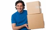 Man Carrying Couple Of Cardboard Boxes Stock Photo