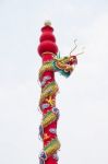 Golden Dragon Statue On Pole In The Chinese Temple In Thailand Stock Photo