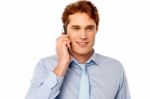 Young Professional Talking On Mobile Stock Photo