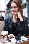 Young Woman Enjoying At Cafe Stock Photo