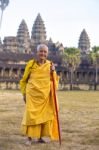 An Unidentified Old Buddhist Female Monk Dressed In Orange Toga Stock Photo