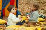 Children Play In The Park And Eating Apple Stock Photo