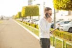 Businessman With Mobile Phone And Tablet In Hands Stock Photo