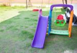 Children Playground On Lawn Park Stock Photo