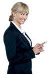 Female Executive Operating Touch Screen Cellphone Stock Photo