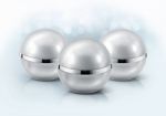 Silver Sphere Cosmetic Jar On Glitter Background Stock Photo