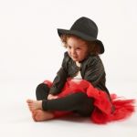 Little Girl Fashion Model With Black Hat Stock Photo