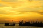 Silhouette Boat At Sunset Stock Photo