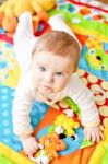 Infant Boy On Playmat Stock Photo