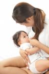 Mother Is Breast Feeding For Her Baby Stock Photo