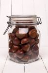 Glass Jar Full Of Chestnuts Stock Photo